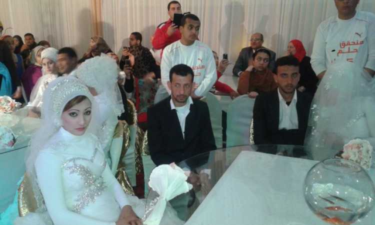 صورة خاصة لحفل زفاف جماعى لعرائس وعرسان أيتام خاص
