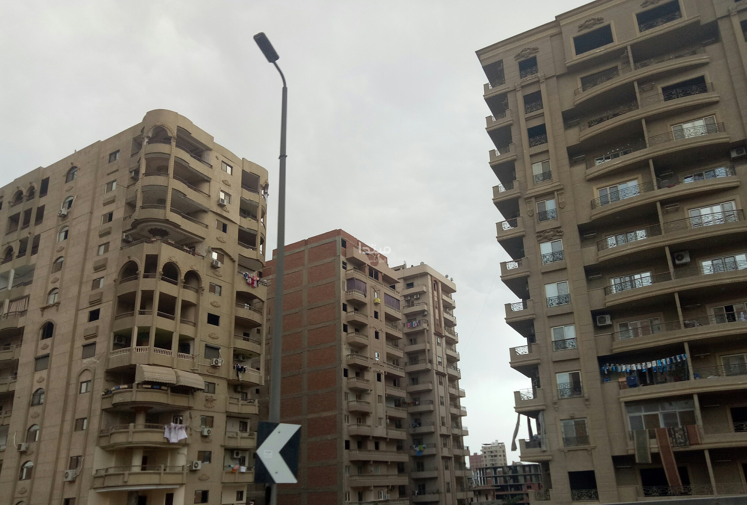 طلاء واجهات العقارات على الطريق الدائرى