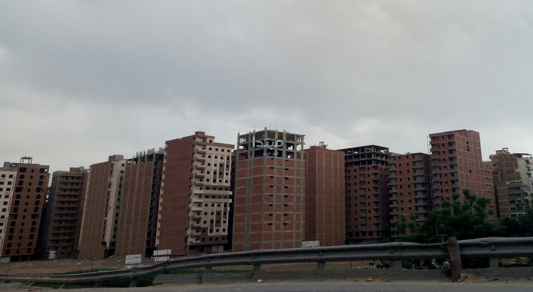 طلاء واجهات العقارات على الطريق الدائرى