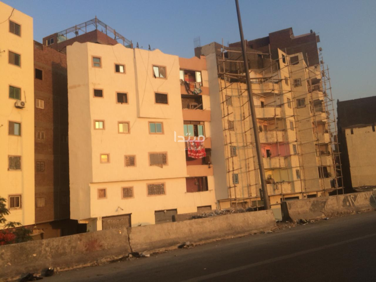 طلاء واجهات العقارات على الطريق الدائرى