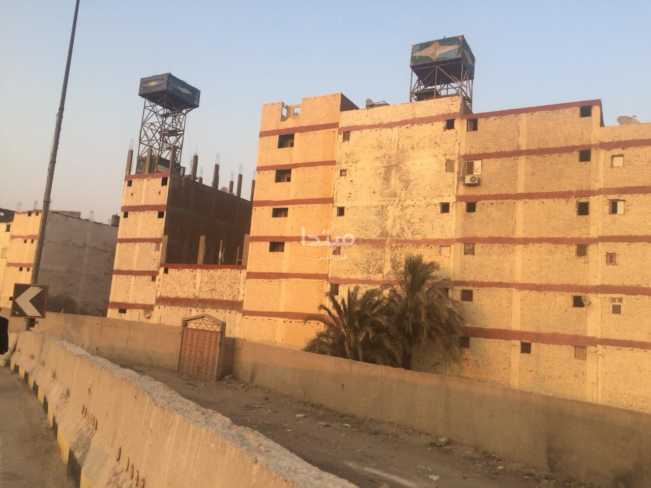 طلاء واجهات العقارات على الطريق الدائرى