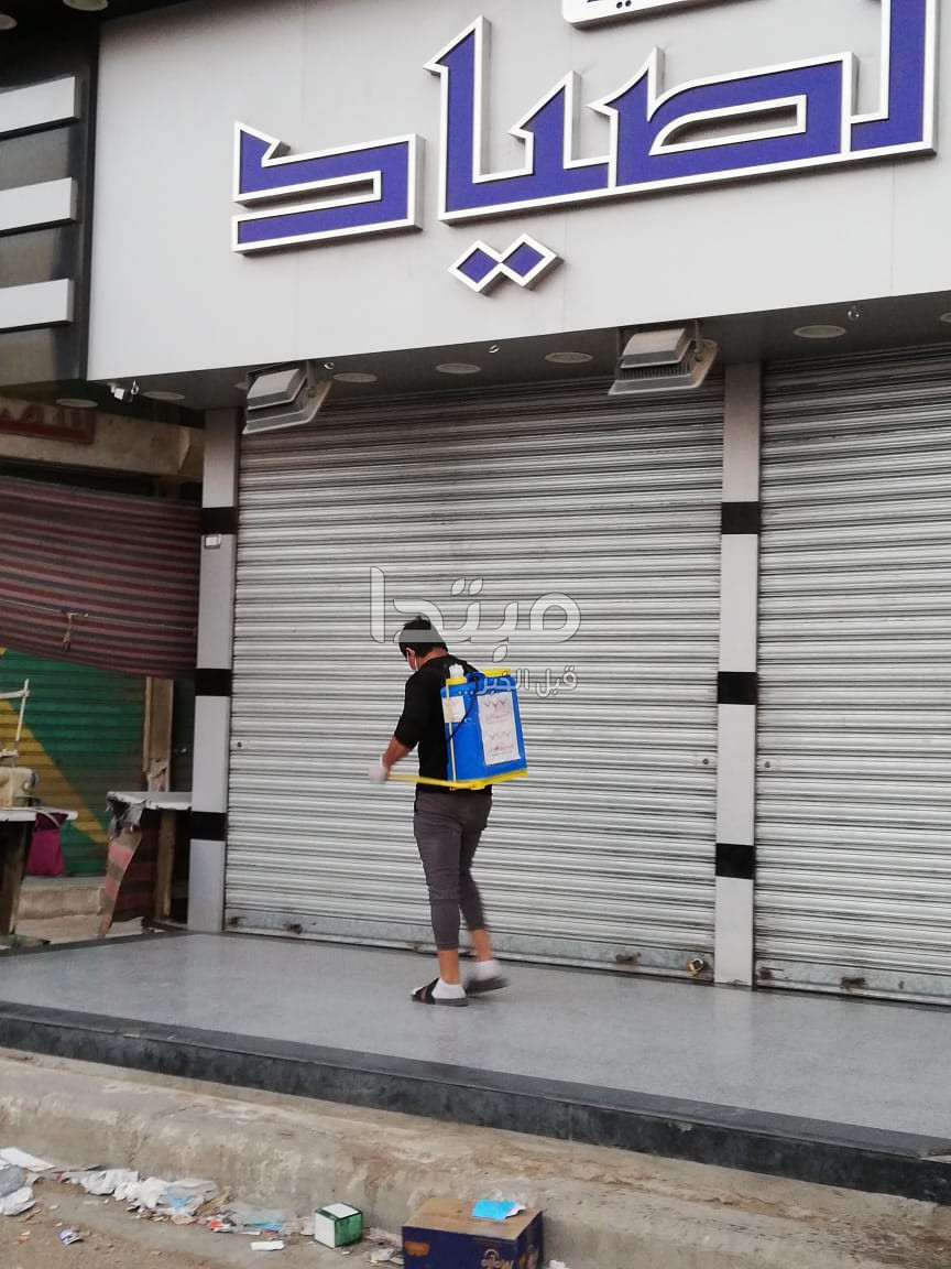 المصريين الأحرار يعقم ميدان الإسعاف والشارع التجارى
